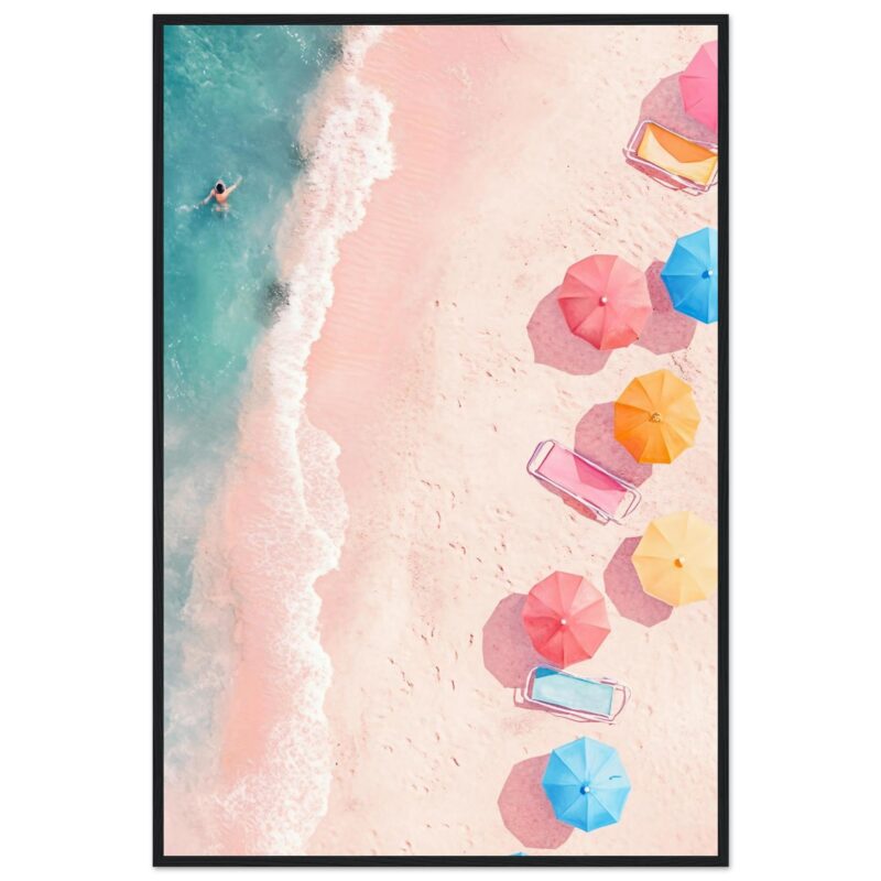 Sombrillas de colores en playa arenosa con vistas aéreas y una persona en el agua.